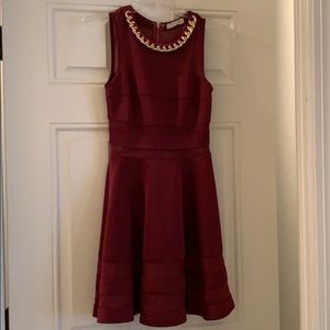 Deep wine colored dress with mesh sections